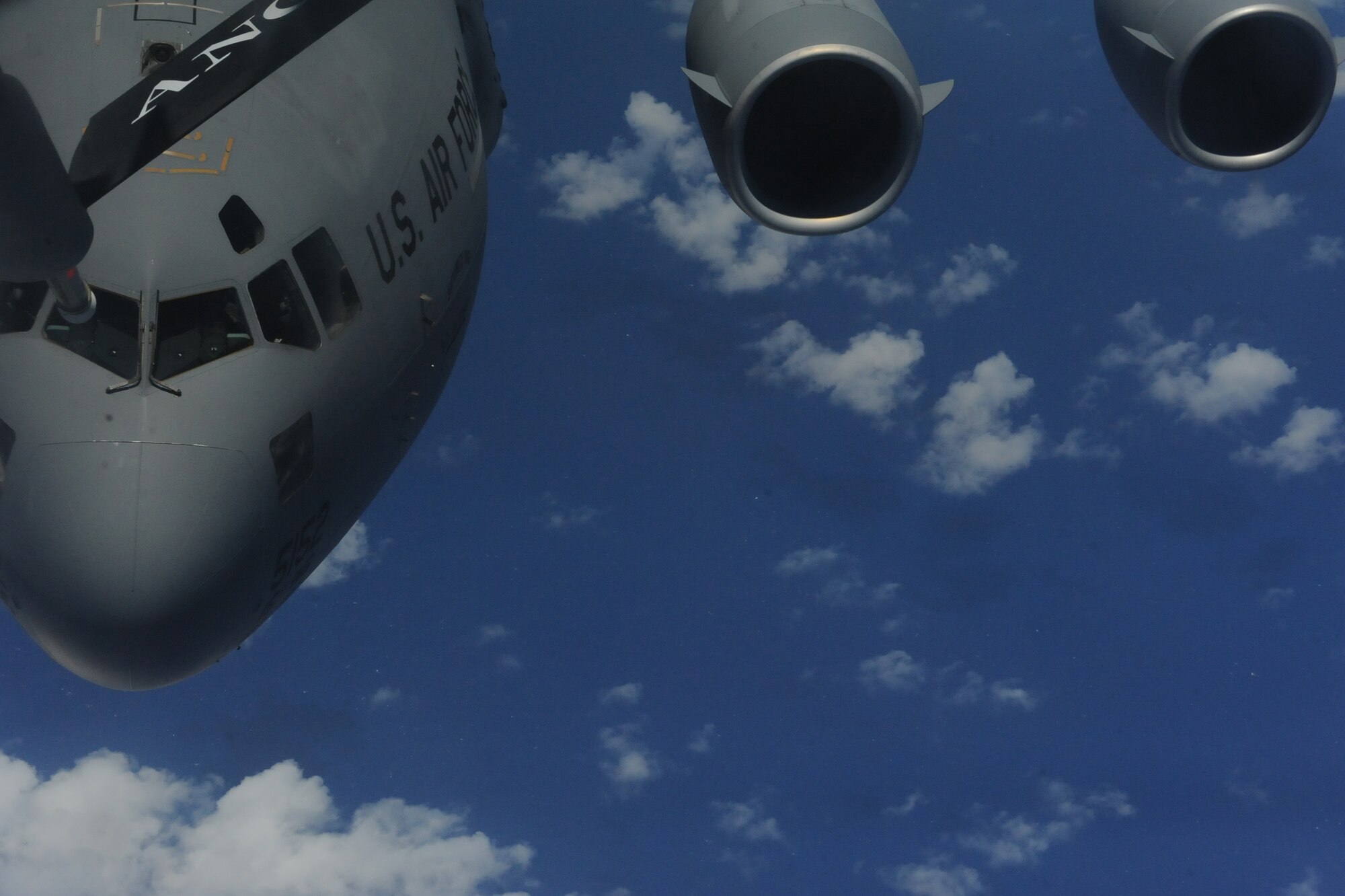 A C-17 Globemaster III from the 535th Airlift Squadron, prepares to connect to a 154th Air Refueling Squadron KC-135 Stratotanker during a  Reserve Officer Training Corps incentive flight hosting cadets from U.S. Air Force ROTC Detachment 175 at the University of Hawaii May 4 at Joint Base Pearl Harbor-Hickam, Hawaii. The flight, which featured 7 cadets from both the U.S. Army and U.S. Air Force, served as an incentive flight for the cadets while simultaneously providing them a glimpse of the operational military. (U.S. Air Force photo by Staff Sgt. Nathan Allen)
