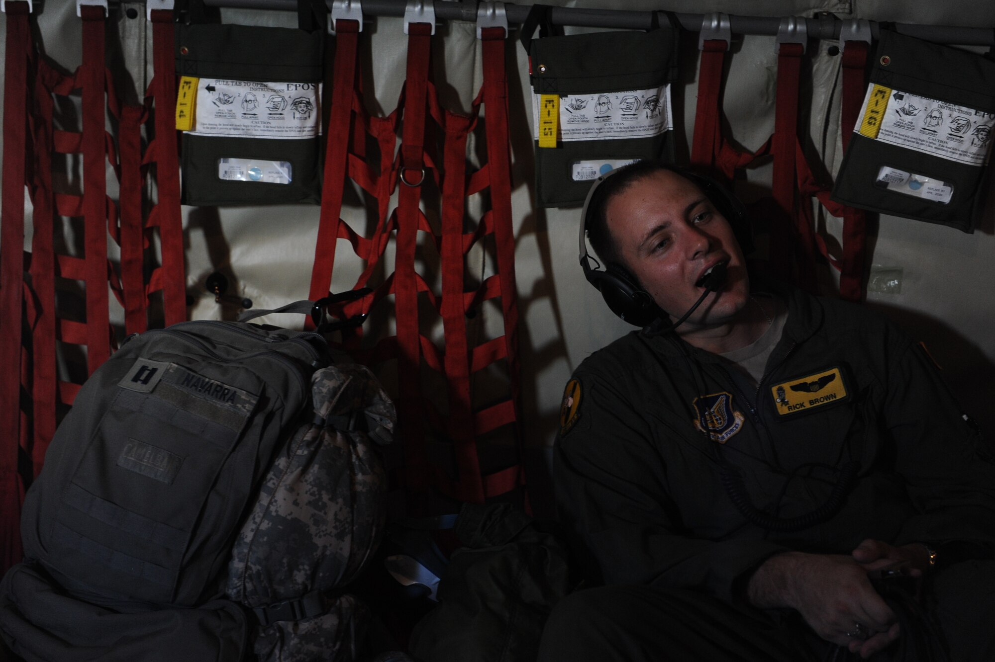 Capt. Rick Brown, 96th Air Refueling Squadron Chief of Safety, jokes with Reserve Officer Training Corps cadets visiting from U.S. Air Force ROTC Detachment 175 at the University of Hawaii during a mission to practice refueling a C-17 Globemaster from the 535th Airlift Squadron May 4 at Joint Base Pearl Harbor-Hickam, Hawaii. The visit, which featured 19 cadets from both the U.S. Army and U.S. Air Force, served as an incentive flight for the cadets while simultaneously providing them a glimpse of the operational military. (U.S. Air Force photo by Staff Sgt. Nathan Allen)