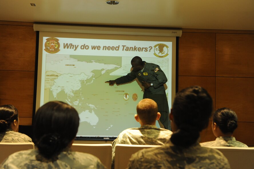 Lt. Col. Brian Hill, 96th Air Refueling Squadron Commander, briefs Reserve Officer Training Corps cadets visiting from U.S. Air Force ROTC Detachment 175 at the University of Hawaii on the history of the 96th ARS and its mission May 4 at Joint Base Pearl Harbor-Hickam, Hawaii. The visit, which featured 19 cadets from both the U.S. Army and U.S. Air Force, served as an incentive flight for the cadets while simultaneously providing them a glimpse of the operational military. (U.S. Air Force photo by Staff Sgt. Nathan Allen)