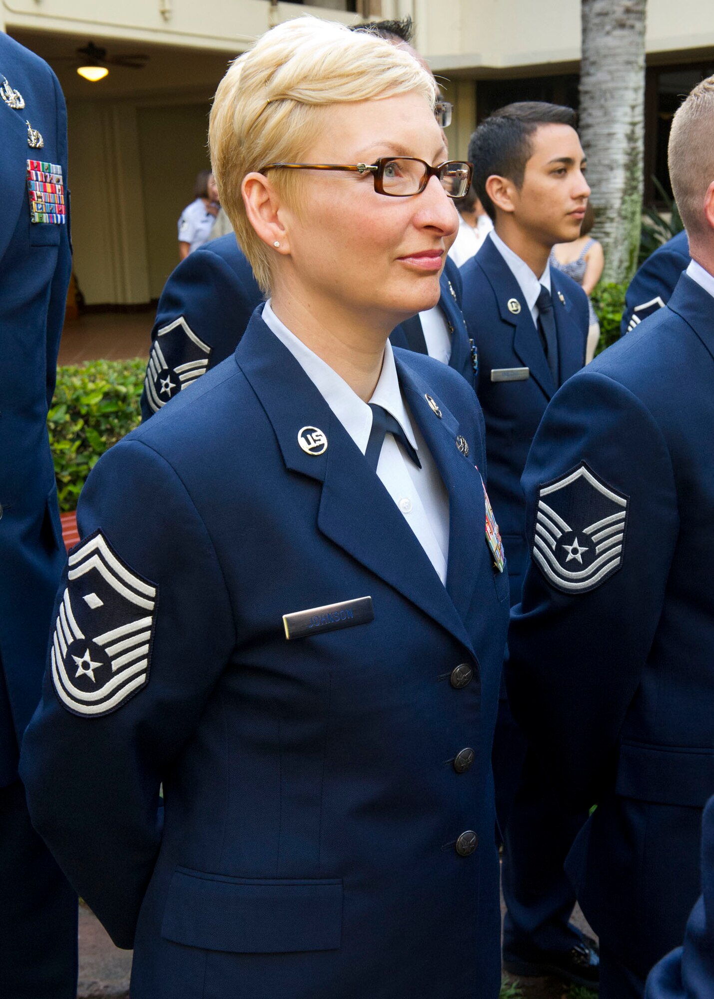 Senior Master Sgt. Nicole M. Johnson, one of Pacific Air Forces 12 Outstanding Airmen of the year, stands at parade rest during a wreath-laying ceremony at the Courtyard of Heroes, Headquarters Pacific Air Forces, Hawaii, April 23, 2012. Gen. Gary North, Pacific Air Forces commander and PACAF’s Command Chief Master Sgt. Brooke McLean joined the outstanding Airmen to honor those who died at Hickam Field, Dec. 7, 1941. (U.S. Air Force photo/Tech. Sgt. Jerome S. Tayborn)