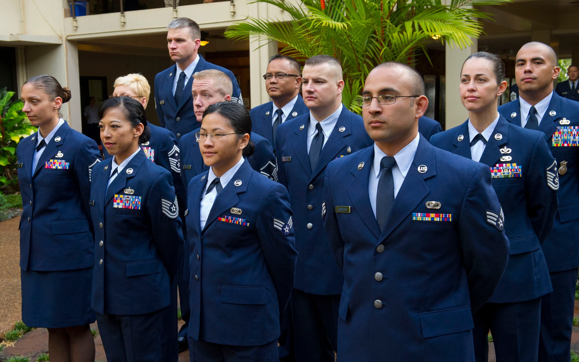 Pacific Air Forces 12 Outstanding Airmen of the Year stand at parade rest during a wreath-laying ceremony at the Courtyard of Heroes, Headquarters Pacific Air Forces, Hawaii, April 23, 2012. Gen. Gary North, Pacific Air Forces commander and PACAF’s Command Chief Master Sgt. Brooke McLean joined the outstanding Airmen to honor those who died at Hickam Field, Dec. 7, 1941. (U.S. Air Force photo/Tech. Sgt. Jerome S. Tayborn)