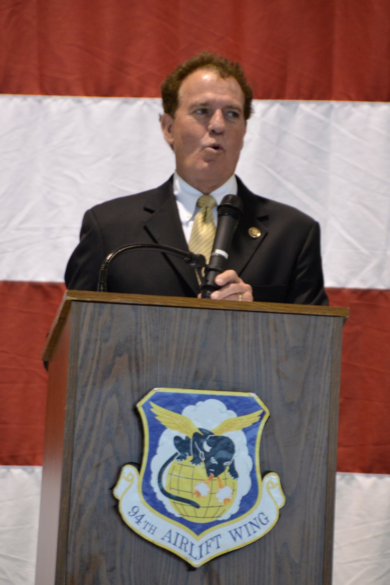 Congressman Phil Gingrey, Georgia’s 11th District, address members, families and friends of the 94th Airlift Wing during a recent deployment departure ceremony at Dobbins Air Reserve Base, Ga. Over 100 94th Airlift Wing members recently deployed to the Middle East to provide personnel and cargo delivery using C-130 aircraft. (U.S. Air Force photo/Master Sgt. James Branch)