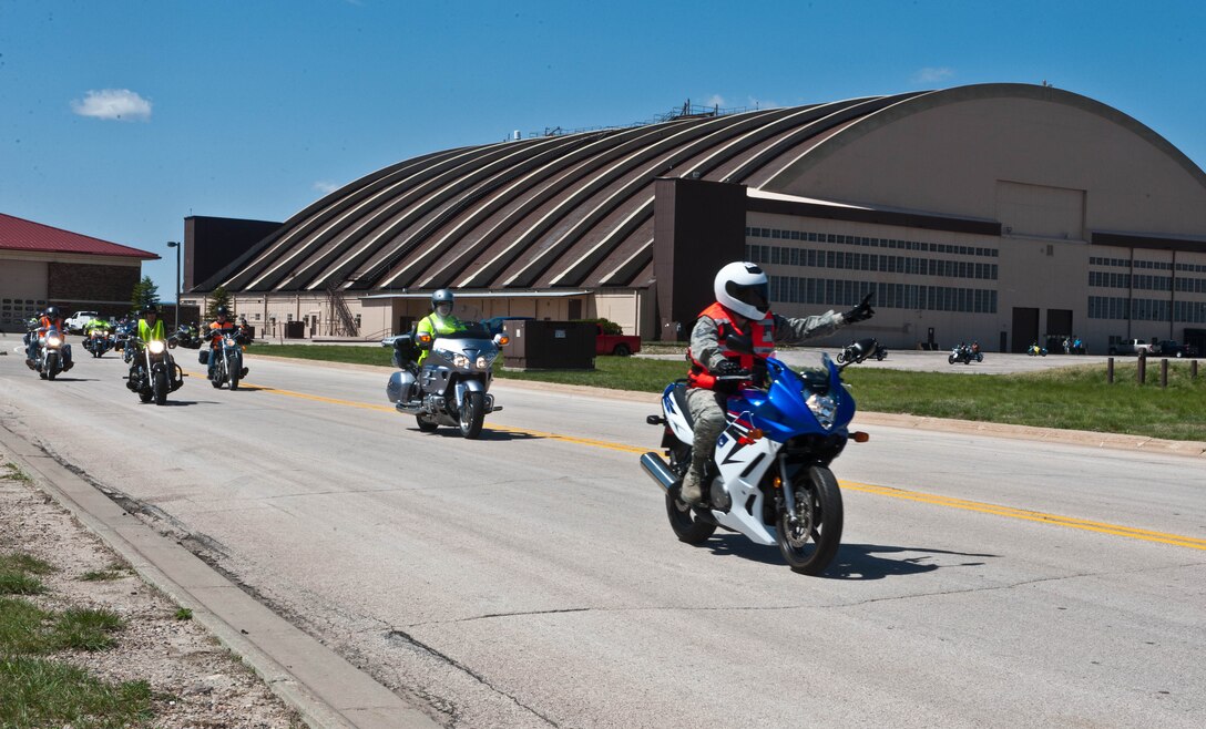 Airmen and riders from surrounding cities, suit up for a group ride during a motorcycle mentorship event at the Pride Hangar at Ellsworth Air Force Base, S.D., April 30, 2012. Participants practiced proper group riding techniques, reviewed safe riding procedures and proper riding attire during the event that culminated with a ride across Ellsworth and throughout the Black Hills. (U.S. Air Force photo by Airman 1st Class Zachary Hada/Released)