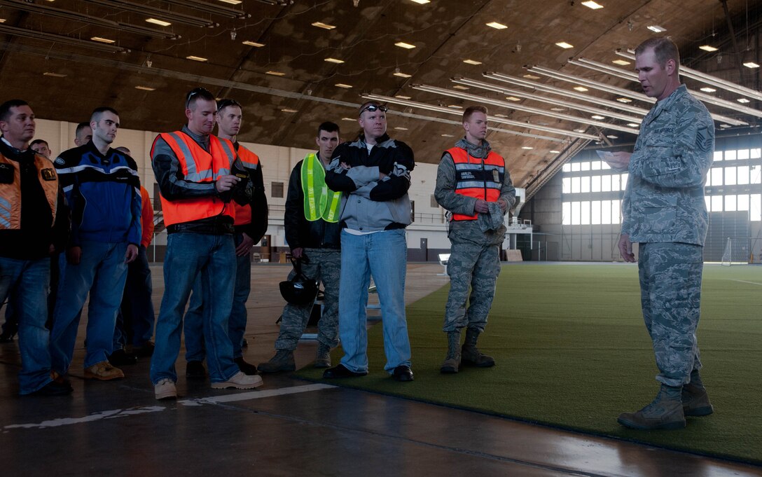Master Sgt.  Joseph Jackson, 28th Munitions Squadron munitions controller, gives a safety briefing to riders during a motorcycle mentorship ride event at the Pride Hangar at Ellsworth Air Force Base, S.D., April 30, 2012. The mentorship ride promoted safe motorcycle riding in an effort to help prevent motorcycle accidents. (U.S. Air Force photo by Airman 1st Class Zachary Hada/Released)