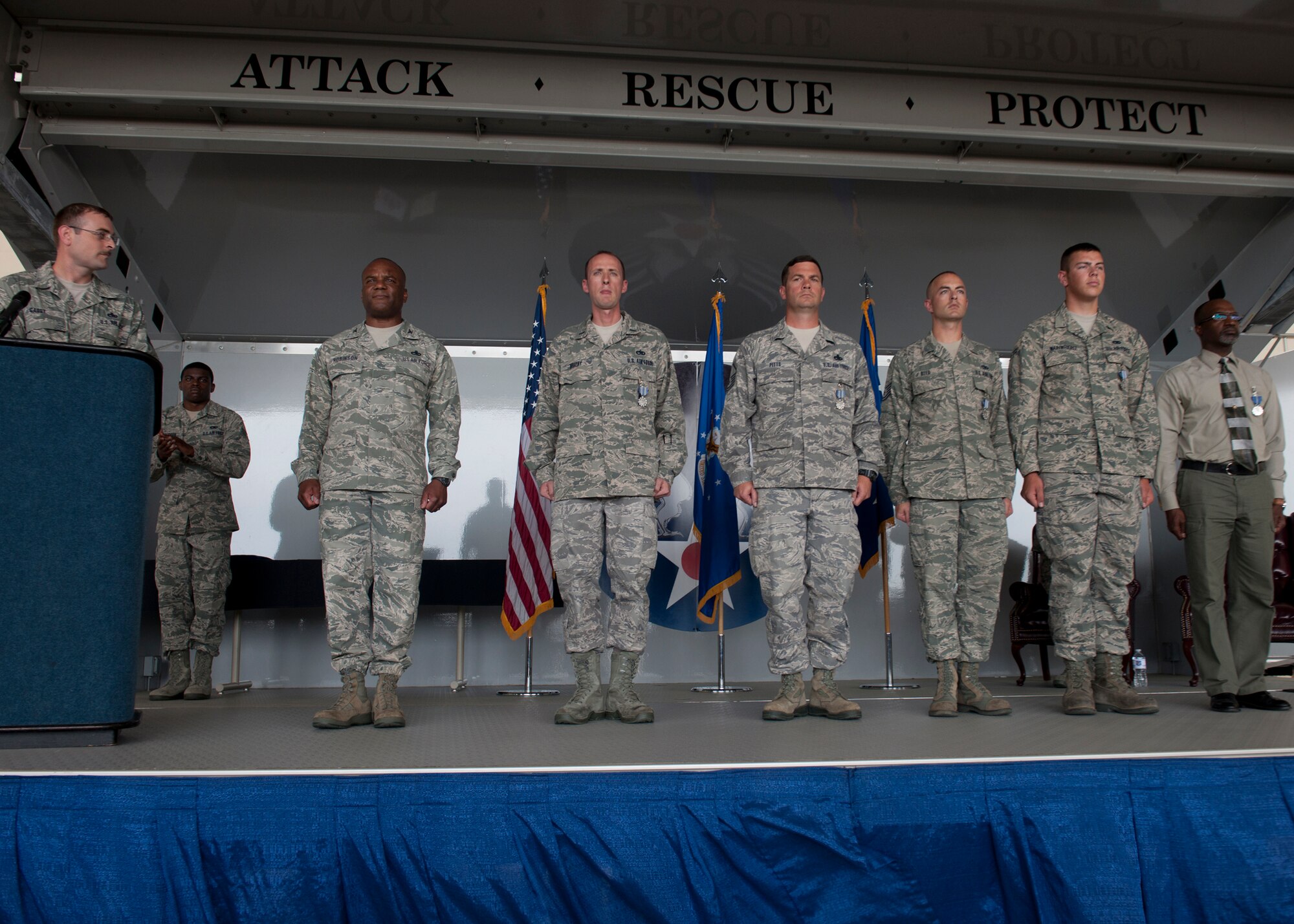 Airmen with the 23d Maintenance Group stand at attention after receiving the Air Force Achievement Medal during the Clements McMullen Memorial Daedalian Weapons System Maintenance Trophy presentation at Moody Air Force Base, Ga. May 4, 2012. The “crown jewel of maintenance awards” was given to the 23d MXG Airmen by distinguished visitor U.S. Air Force Lt. Gen. Judith Fedder, Headquarters U.S. Air Force, Washington, D.C. deputy chief of staff for logistics, installations and mission support. Fedder spoke briefly about Team Moody and the hard work it took meeting all objectives of providing safe, serviceable equipment and manpower wherever needed at any time. (U.S. Air Force photo by Senior Airman Eileen Meier/Released)