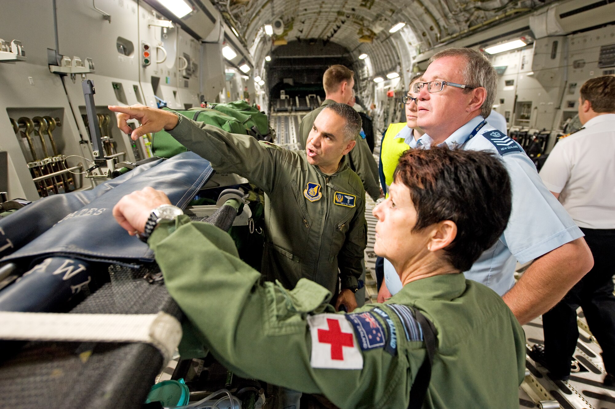Master Sgt. Enrique Ferreira, an International Health Specialist from 13th Air Force at Joint Base Pearl Harbor-Hickam, Hawaii, demonstrates the U.S. Air Force’s Oxygen/Electrical capabilities for aeromedical evacuation use to Royal New Zealand Air Force aeromedics on board a U.S. C-17 Globemaster III during a subject matter exchange conference at Phenuapai Air Base, New Zealand, in April 2012.  The conference allowed both Air Forces to discuss how each country conducts operations to ensure future engagements, either real world or training, are as effective as possible. This meeting was conducted because a seamless response does not happen automatically; it is the result of exchanges and training events that increase operations awareness between counterparts.  (U.S. Air Force photo/ Capt. Rebecca Heyse) 
