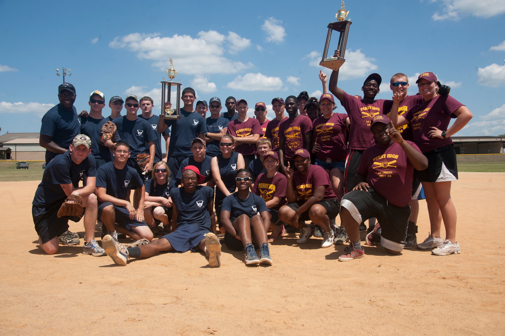 Perry High school Junior ROTC and Tifton County Junior ROTC softball teams pose after the annual first Sergeants Association Spring Air Force JROTC softball tournament game at Moody Air Force Base Ga., May 5th, 2012. Perry placed first as they went undefeated in the tournament and won with a final score of 12 to 11. (U.S. Air Force photo by Airman 1st Class Paul Francis/Released)
