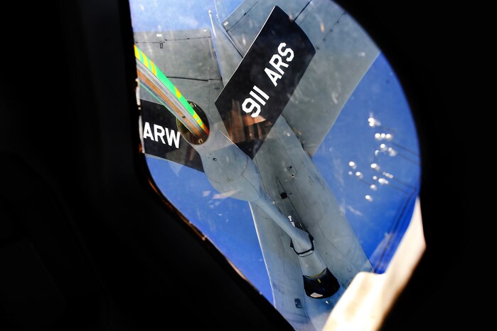 Capt. James Marceletti III, along with Capt. Andrew Mickles and Capt. Matthew Benza fly an in-flight refueling mission May 2. The flight took place on a C-17 Globemaster III. A KC-135 tanker refueled the C-17 in mid-air, allowing the receiving aircraft to remain airborne longer, extending its range or loiter time on station. Marceletti, Mickles and Benza are pilots with the 15th Airlift Squadron, 437th Airlift Wing. (U.S. Air Force photo/ Airman 1st Class Ashlee Galloway)