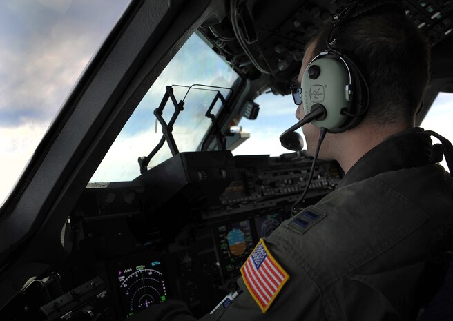 Capt. Andrew Mickles flies an in-flight refueling mission May 2. The flight took place on a C-17 Globemaster III. A KC-135 tanker refueled the C-17 in mid-air, allowing the receiving aircraft to remain airborne longer, extending its range or loiter time on station. Mickles is a pilot from the 15th Airlift Squadron, 437th Airlift Wing. (U.S. Air Force photo/ Airman 1st Class Ashlee Galloway)