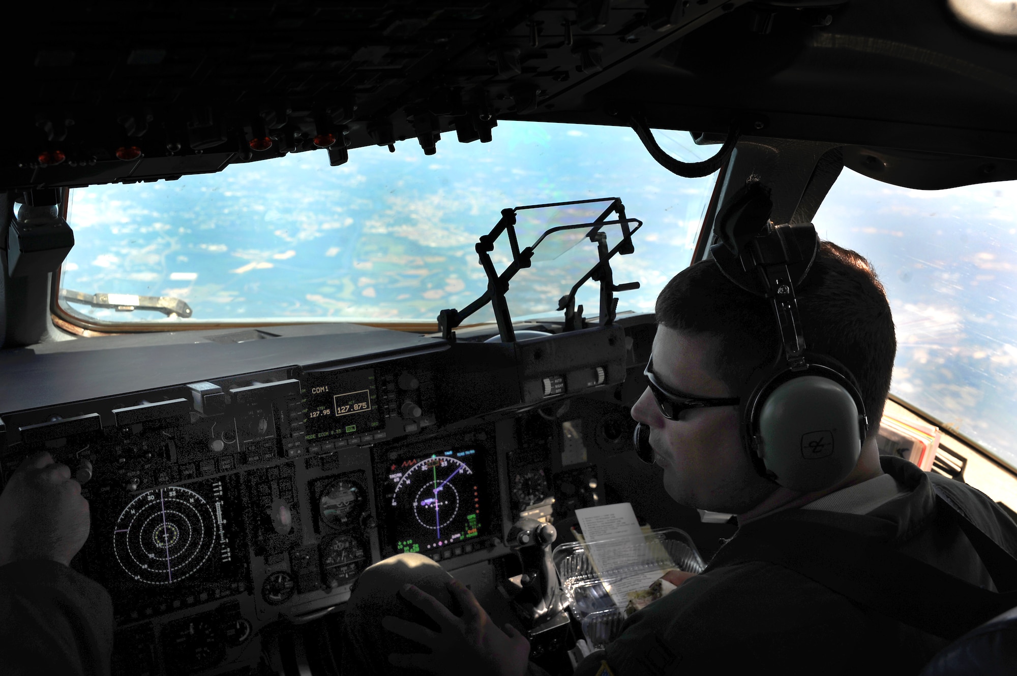 Capt. James Marceletti III flies an in-flight refueling mission May 2. The flight took place on a C-17 Globemaster III. A KC-135 tanker refueled the C-17 in mid-air, allowing the receiving aircraft to remain airborne longer, extending its range or loiter time on station. Marceletti is a pilot with the 15th Airlift Squadron, 437th Airlift Wing. (U.S. Air Force photo/ Airman 1st Class Ashlee Galloway)