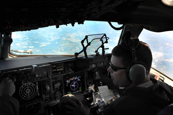 Capt. James Marceletti III flies an in-flight refueling mission May 2. The flight took place on a C-17 Globemaster III. A KC-135 tanker refueled the C-17 in mid-air, allowing the receiving aircraft to remain airborne longer, extending its range or loiter time on station. Marceletti is a pilot with the 15th Airlift Squadron, 437th Airlift Wing. (U.S. Air Force photo/ Airman 1st Class Ashlee Galloway)