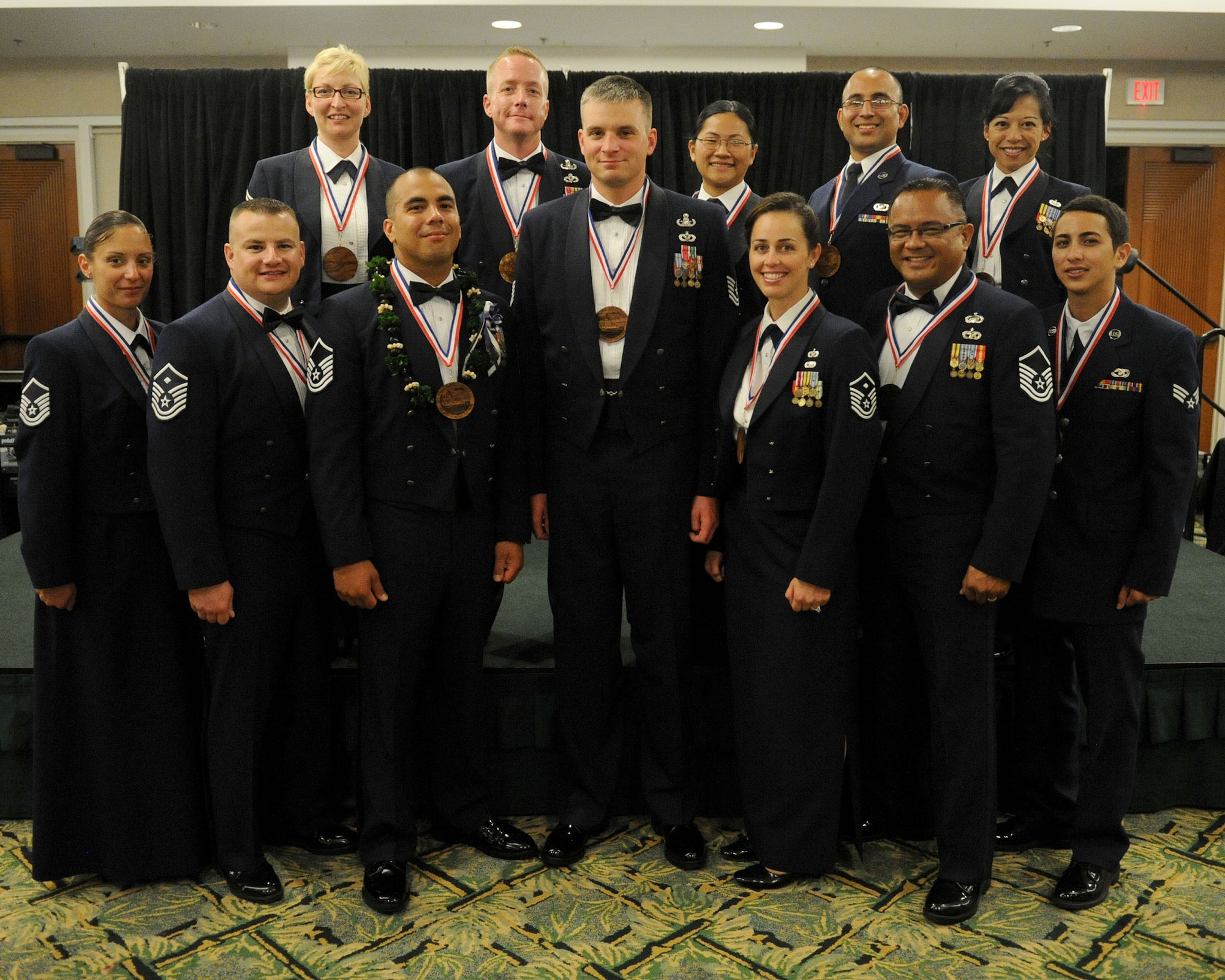 Pacific Air Forces 12 Outstanding Airmen of the Year for 2012 pose for a group photo at the Tradewinds Enlisted Club, Joint Base Pearl Harbor-Hickam, Hawaii, April 27, 2012. (U.S. Air Force photo/Tech. Sgt. Jerome S. Tayborn)