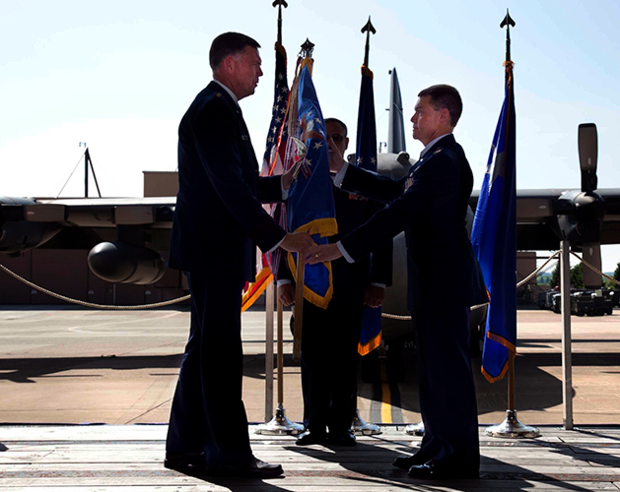 Col. Craig C. Peters, 911th Airlift Wing commander, receives the ceremonial guidon from Maj. Gen. Wallace W. “Wade” Farris, 22nd Air Force commander, and assumes command of the 911th Airlift Wing in front of the men and women of the 911th, family, friends, elected officials and community partners at hangar 416, May 6, 2012. Col. Peters served as C-17 and C-5 evaluator and instructor pilot, but also flew the T-41, T-37, T-38, C-130, B727 and MD-88. The Colonel has flown in every operational conflict since Operation Desert storm and generated more than 6,800 flying hours. (U.S. Air Force photo by Tech. Sgt. Ralph Van Houtem/Released)