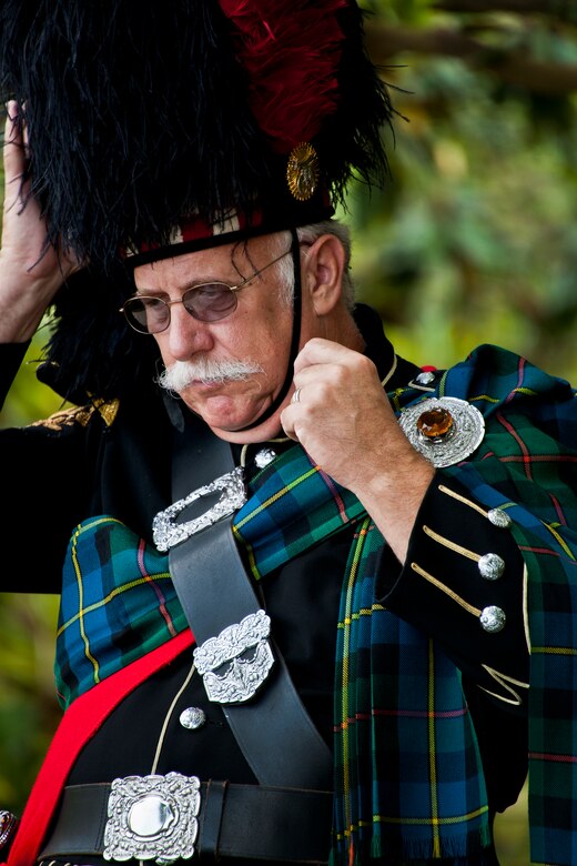 A bagpiper makes a last minute hat adjustment before performing during the 43rd Annual EOD Memorial Ceremony May 5, 2012, at Eglin Air Force Base, Fla.  (U.S. Air Force photo/Samuel King Jr.)
