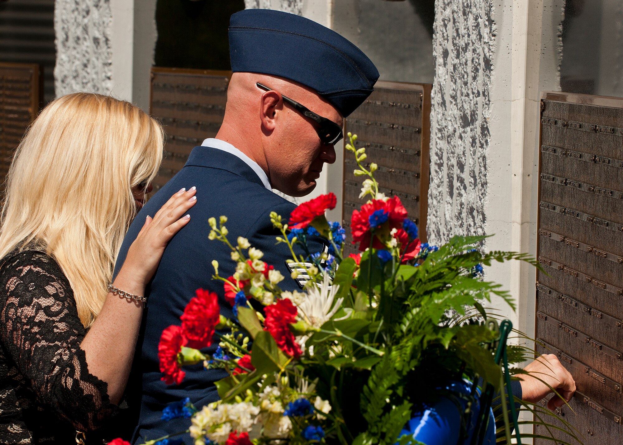 An Air Force NCO remembers his fallen Airman whose name is now inscribed on the explosive ordnance disposal memorial wall after the 43rd Annual EOD Memorial Ceremony May 5, 2012, at Eglin Air Force Base, Fla.  Air Force Chief of Staff Gen. Norton Schwartz was the guest speaker for the event that honored 18 EOD technicians, five of which were Airmen.  With the new names added, there are now 287 names inscribed on the memorial wall.  (U.S. Air Force photo/Samuel King Jr.)