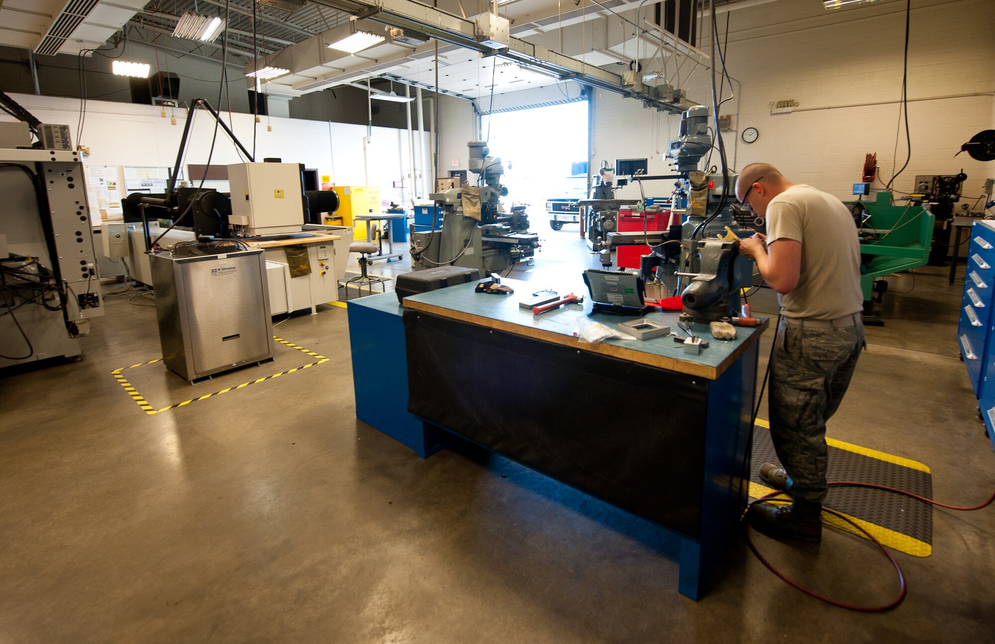 Airman 1st Class Justin Morris, 28th Maintenance Squadron metals technology apprentice, prepares to replace an unserviceable B-1 bomber bell crank housing in the metals technology shop at Ellsworth Air Force Base, S.D., May 2, 2012. Airmen rely on the metals technology shop for all welding maintenance of tools and equipment needed to successfully accomplish the base’s mission. (U.S. Air Force photo by Airman 1st Class Kate Thornton/Released)