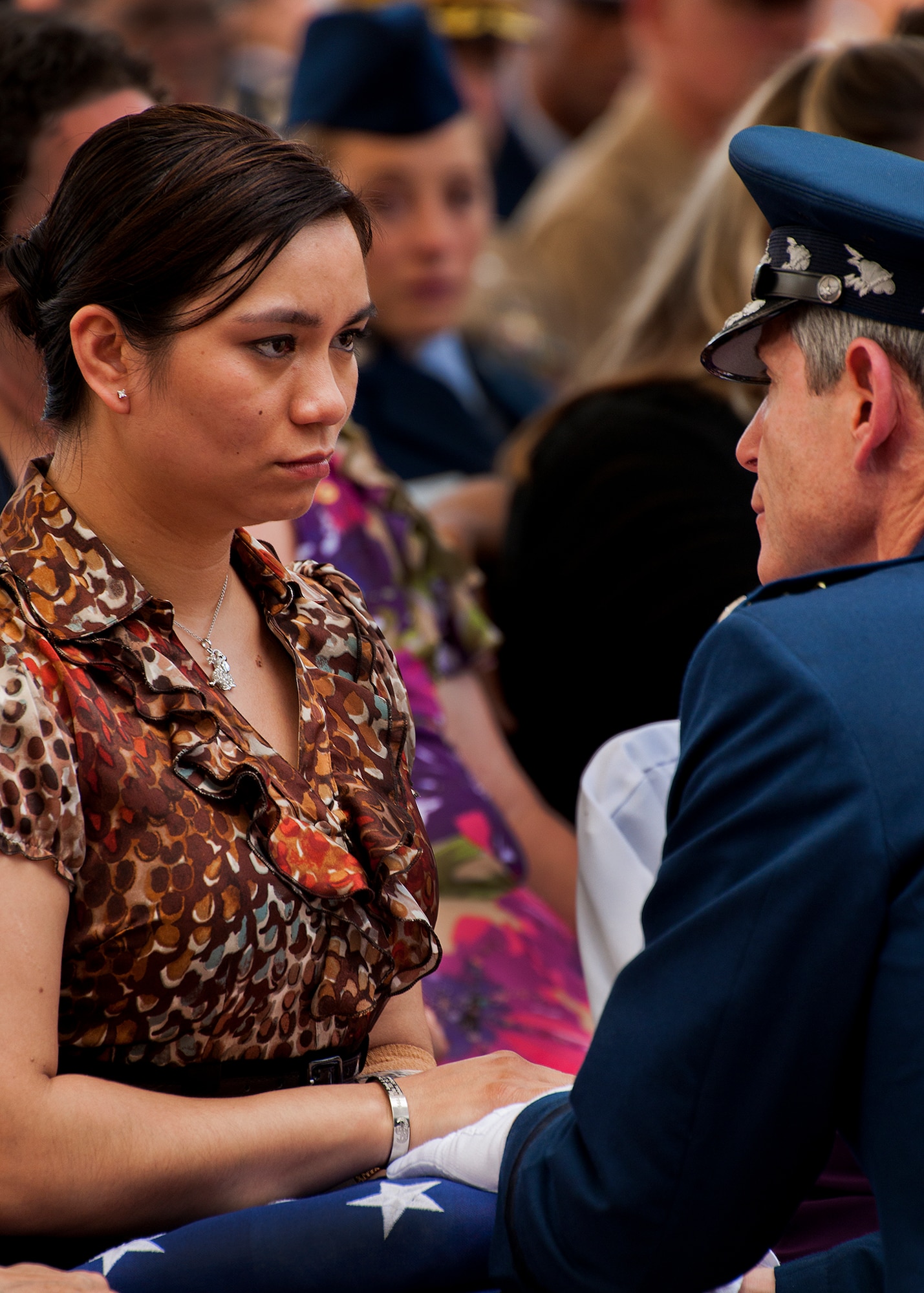Air Force Chief of Staff Gen. Norton Schwartz presents a folded flag to Christina Hamski during the annual Explosive Ordnance Disposal Memorial Ceremony May 5, 2012, at Eglin Air Force Base, Fla.  Hamski’s husband, Staff Sgt. Joseph Hamski, was one of five fallen EOD Airmen honored at the event.  (U.S. Air Force photo/Samuel King Jr.)