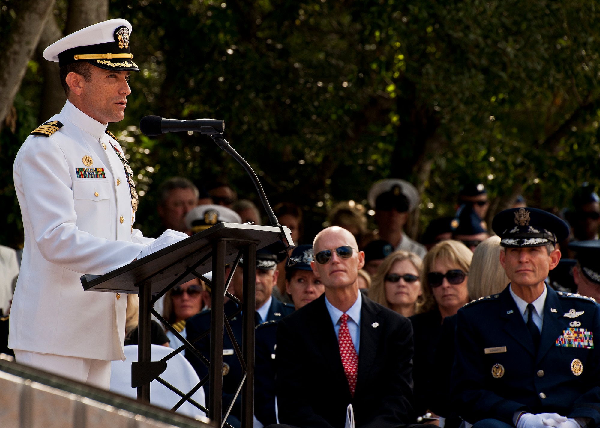 Capt. Joseph Polanin, the Navy explosive ordnance disposal school’s commander, speaks to the crowd as Florida Governor Rick Scott and Air Force Chief of Staff Gen. Norton Schwartz listen during the annual memorial ceremony May 5, 2012, at Eglin Air Force Base, Fla. Schwartz was the guest speaker at the event that honored 18 EOD technicians, five of which were Airmen.  With the new names added, there are now 287 names inscribed on the memorial wall.  (U.S. Air Force photo/Samuel King Jr.)