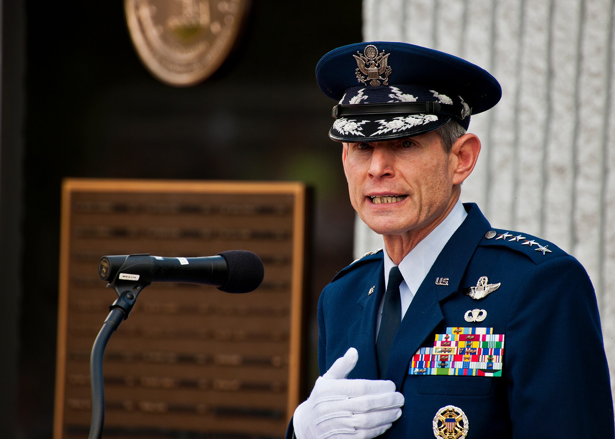 Standing in front of the explosive ordnance disposal memorial wall, Air Force Chief of Staff Gen. Norton Schwartz speaks to a crowd of hundreds during the annual EOD Memorial Ceremony May 5, 2012, at Eglin Air Force Base, Fla. Schwartz was the guest speaker at the event that honored 18 EOD technicians, five of which were Airmen.  With the new names added, there are now 287 names inscribed on the memorial wall.  (U.S. Air Force photo/Samuel King Jr.)
