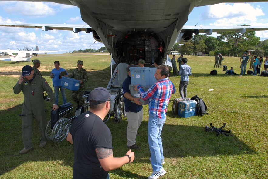 120427-A-WP252-001- Colombian military members and U.S. Army Civil Affairs Soldiers assigned to Company B, 98th Battalion, 95th CA Brigade (Airborne) unload two tons of medical supplies and equipment off a Colombian military cargo plane in preparation for a two-day Surgical Civic Action Program (SURGCAP) April 27-28 in the small town of La Macarena, Colombia, located 170 miles south of Bogota. The SURGCAP, which was organized by the Colombian military with support from U.S. Army Civil Affairs Soldiers, helped provide medical services in such fields as pediatrics, dermatology, general medicine, optometry, ophthalmology, dentistry, and general surgery to more than 1,000 citizens living in the remote town. (Department of Defense photo by Sgt. 1st Class Alex Licea, Special Operations Command South Public Affairs) (Contributing reporter for the U.S. Embassy in Bogota.)
