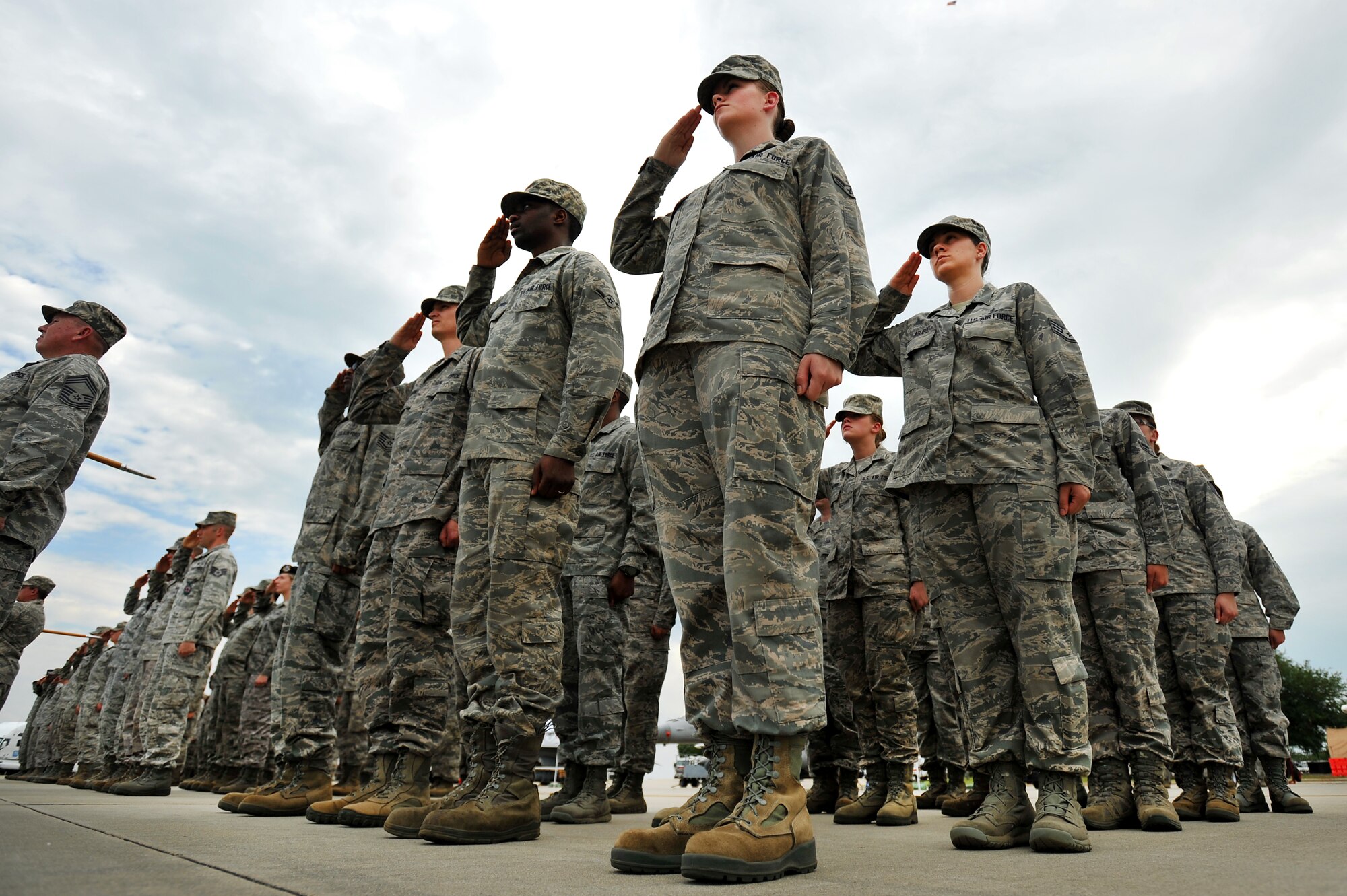 U.S. Air Force Airmen assigned to the 20th Fighter Wing render a salute during a retreat ceremony, May 4, 2012, Shaw Air Force Base, S.C. Shaw's Honor Guard conducted the retreat ceremony at the end of the first day of Shaw's Air Expo. More than 80 Airmen assigned to the 20th Fighter Wing, including the 20th FW Commander Col. Clay Hall, stood in formation for the retreat. (U.S. Air Force photo by Senior Airman Kenny Holston/Released)


