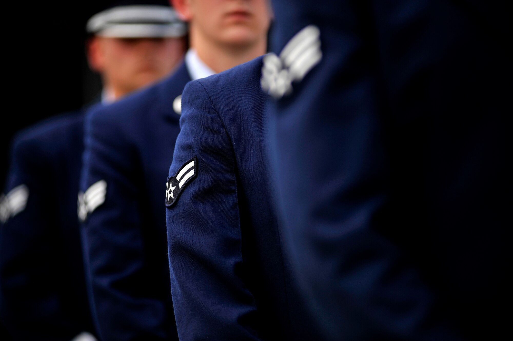 U.S. Air Force Airmen in the grades of E-4 and below make up the core of the Shaw Air Force Base Honor guard. Pictured here an Airman 1st Class and other members of Shaw's Honor Guard stand in formation in preparation to perform a retreat ceremony, May 4, 2012, Shaw Air Force Base S.C. Shaw's Honor Guard conducted the retreat ceremony at the end of the first day of Shaw's Air Expo. More than 80 Airmen assigned to the 20th Fighter Wing, including the 20th FW Commander Col. Clay Hall, stood in formation for the retreat. (U.S. Air Force photo by Senior Airman Kenny Holston/Released)



