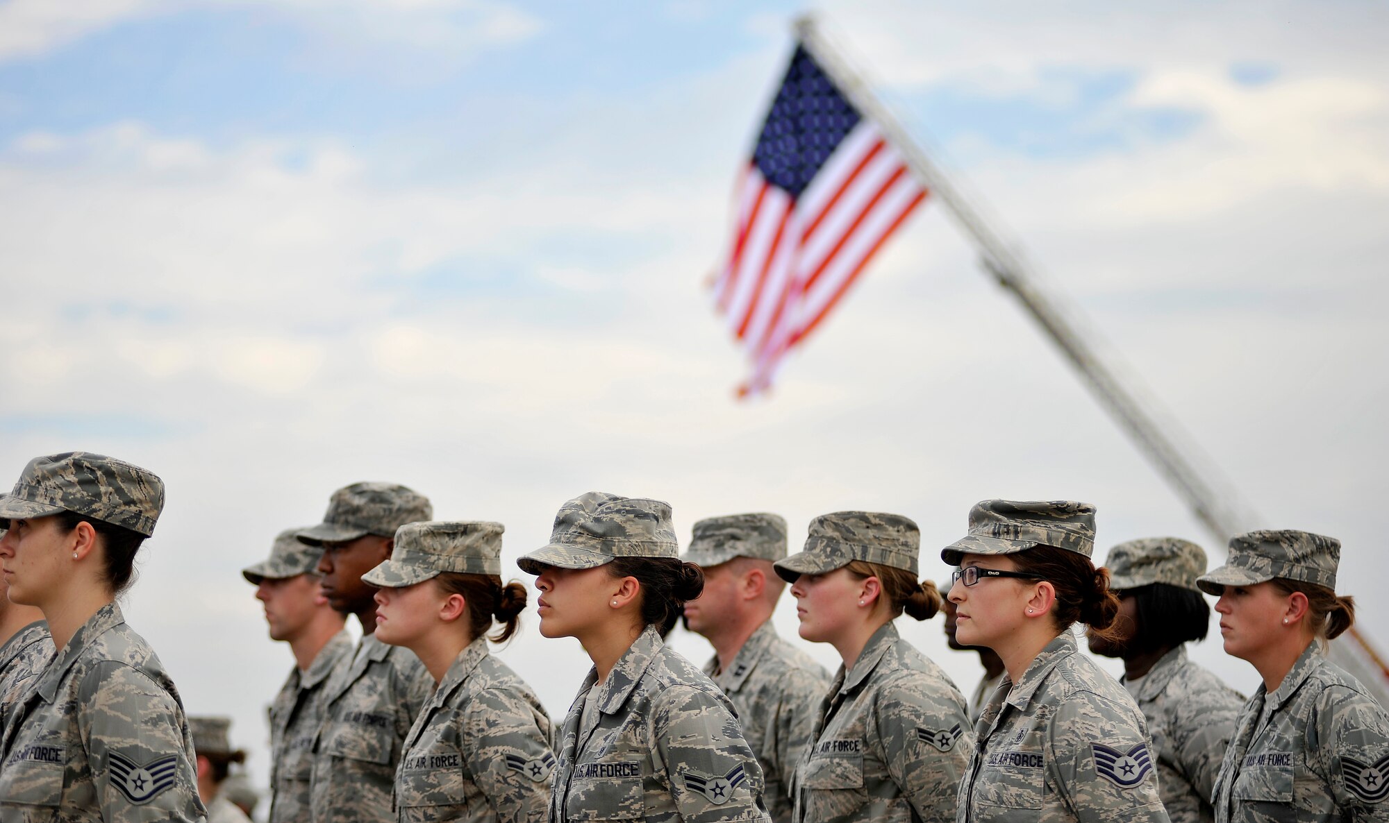 U.S. Air Force Airmen assigned to the 20th Fighter Wing stand in formation for a retreat ceremony, May 4, 2012, Shaw Air Force Base, S.C. Shaw's Honor Guard conducted the retreat ceremony at the end of the first day of Shaw's Air Expo. More than 80 Airmen assigned to the 20th Fighter Wing, including the 20th FW Commander Col. Clay Hall, stood in formation for the retreat. (U.S. Air Force photo by Senior Airman Kenny Holston/Released)


