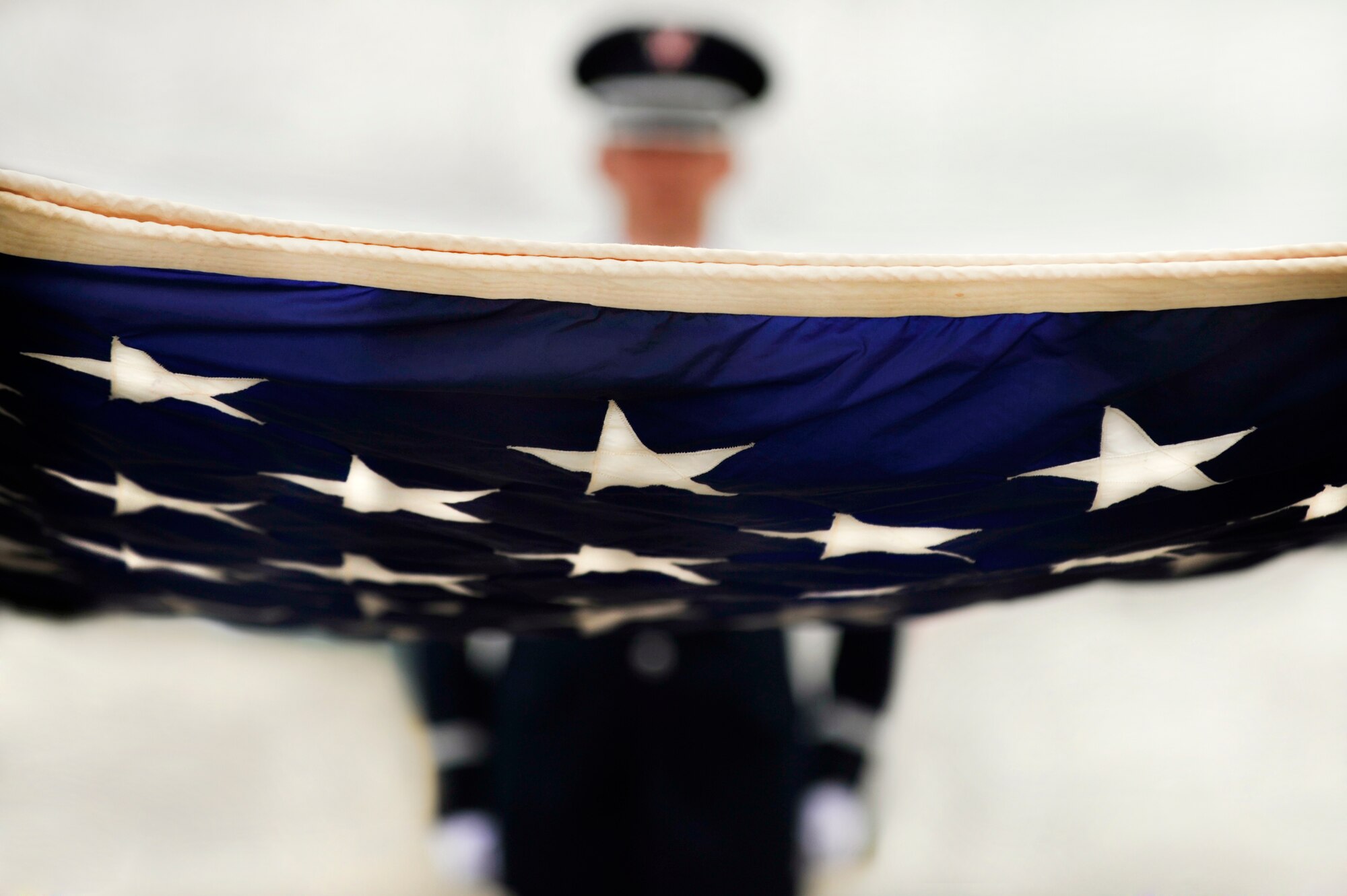 The United States flag is stretched out in preparation to be folded during a retreat ceremony performed by the Shaw Air Force Base Honor Guard, May 4, 2012, Shaw Air Force Base, S.C. Shaw's Honor Guard conducted the retreat ceremony at the end of the first day of Shaw's Air Expo. More than 80 Airmen assigned to the 20th Fighter Wing, including the 20th FW Commander Col. Clay Hall, stood in formation for the retreat. (U.S. Air Force photo by Senior Airman Kenny Holston/Released)


