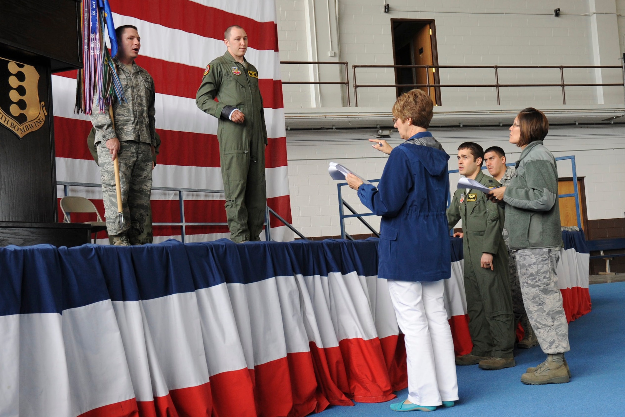 Arliss Sakos (center), chief of the 28th Bomb Wing Protocol Office, reviews the sequence for a change of command during a rehearsal at the Pride Hangar at Ellsworth Air Force Base, S.D., May 1, 2012. The base protocol office plays a vital role in coordinating and overseeing a wide range of activities, ranging from hosting distinguished visitors to promotions, to changes of command and other special events. (U.S. Air Force photo by Airman 1st Class Anania Tekurio/Released) 
