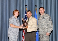 Col. Kimberly Toney (left), Air Force Recruiting Service vice commander, and Chief Master Sgt. William Cavenaugh (left), AFRS chief, present the Supervisor Civilian Category II of the Quarter Award to Kristopher Kite, 902nd Communications Squadron. The first-quarter Joint Base San Antonio-Randolph award winners were recognized during an awards ceremony at the base theater May 4. (U.S. Air Force photo by Melissa Peterson)