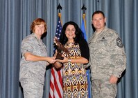 Col. Kimberly Toney (left), Air Force Recruiting Service vice commander, and Chief Master Sgt. William Cavenaugh (left), AFRS chief, present the Non-Supervisor Civilian Category III of the Quarter Award to Susie Parson, Air Force Personnel Center. The first-quarter Joint Base San Antonio-Randolph award winners were recognized during an awards ceremony at the base theater May 4. (U.S. Air Force photo by Melissa Peterson)