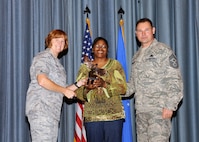 Col. Kimberly Toney (left), Air Force Recruiting Service vice commander, and Chief Master Sgt. William Cavenaugh (left), AFRS chief, present the Non-Supervisor Civilian Category II of the Quarter Award to Celethia Deans, Air Force Personnel Center. The first-quarter Joint Base San Antonio-Randolph award winners were recognized during an awards ceremony at the base theater May 4. (U.S. Air Force photo by Melissa Peterson)