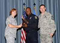 Col. Kimberly Toney (left), Air Force Recruiting Service vice commander, and Chief Master Sgt. William Cavenaugh (left), AFRS chief, present the Non-Supervisor Civilian Category I of the Quarter Award to Shelbyll J. Martin, 902nd Security Forces. The first-quarter Joint Base San Antonio-Randolph award winners were recognized during an awards ceremony at the base theater May 4. (U.S. Air Force photo by Melissa Peterson)