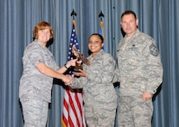 Col. Kimberly Toney (left), Air Force Recruiting Service vice commander, and Chief Master Sgt. William Cavenaugh (left), AFRS chief, present the Honor Guard Airman of the Quarter Award to Senior Airman Micaela S-R Gonzalez , 902nd Force Support Squadron. The first-quarter Joint Base San Antonio-Randolph award winners were recognized during an awards ceremony at the base theater May 4. (U.S. Air Force photo by Melissa Peterson)