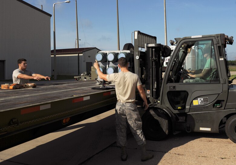 Airman 1st Class Cameron Neigh, 2nd Munitions Squadron storage and handling, transports munitions using a 6K forklift on Barksdale Air Force Base, La., May 4. The 2 MUNS storage and handling unit is responsible for transporting and storing munitions. (U.S. Air Force photo/Airman 1st Class Benjamin Gonsier)(RELEASED)