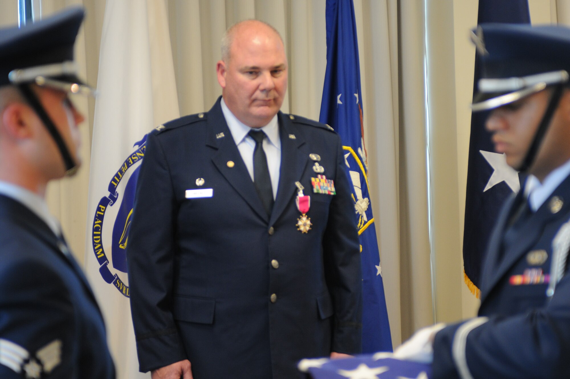 6)	Col. Joseph Sweeney watches on as two honor guardsmen fold the flag during his retirement ceremony on Otis Air National Guard Base May 5, 2012 Col. Sweeney is retiring from a military career which began as a Marine, before he transitioned to the Air National Guard in 1992. He commanded both at the squadron and group levels during his career which spanned more than 30 years. Hundreds of Sweeney’s relatives, friends and fellow Airmen were in attendance to celebrate Sweeney’s career coming to a close. (Air National Guard photo by Senior Airman Patrick McKenna/Released)
