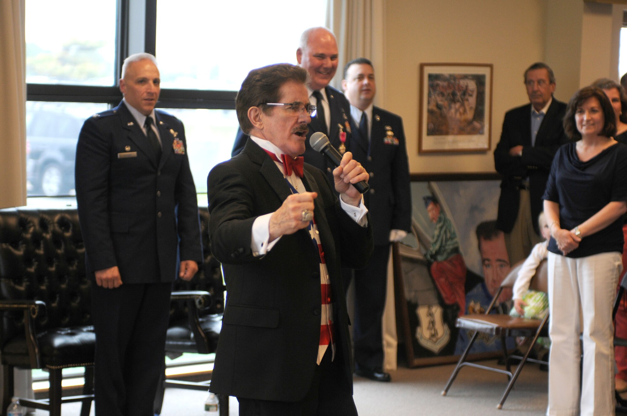 Rene Rancourt, Boston Bruins national anthem singer for more than 30 years, closed the ceremony with the singing of both the Marine Corps hymn and Air Force song. Col. Sweeney is retiring from a military career which began as a Marine, before he transitioned to the Air National Guard in 1992. He commanded both at the squadron and group levels during his career which spanned more than 30 years. Hundreds of Sweeney’s relatives, friends and fellow Airmen were in attendance to celebrate Sweeney’s career coming to a close. (U.S. Air Force photo/Senior Airman Patrick McKenna)