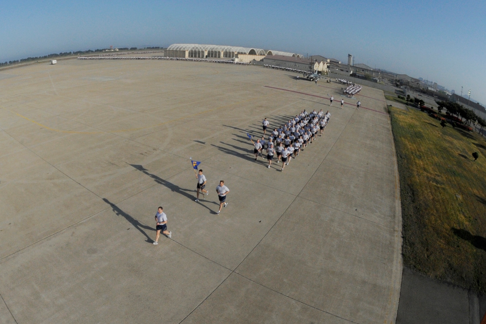 A formation is led by Col. Scott L. Pleus, 8th Fighter Wing commander, during an early morning Warrior Run on Kunsan Air Base, Republic of Korea, May 4, 2012. Members of the 8th Fighter Wing recently finished a four-week inspection by the Pacific Air Forces Inspector General earning an ‘Excellent’ rating. (U.S. Air Force photo/ Senior Airman Jessica Hines)