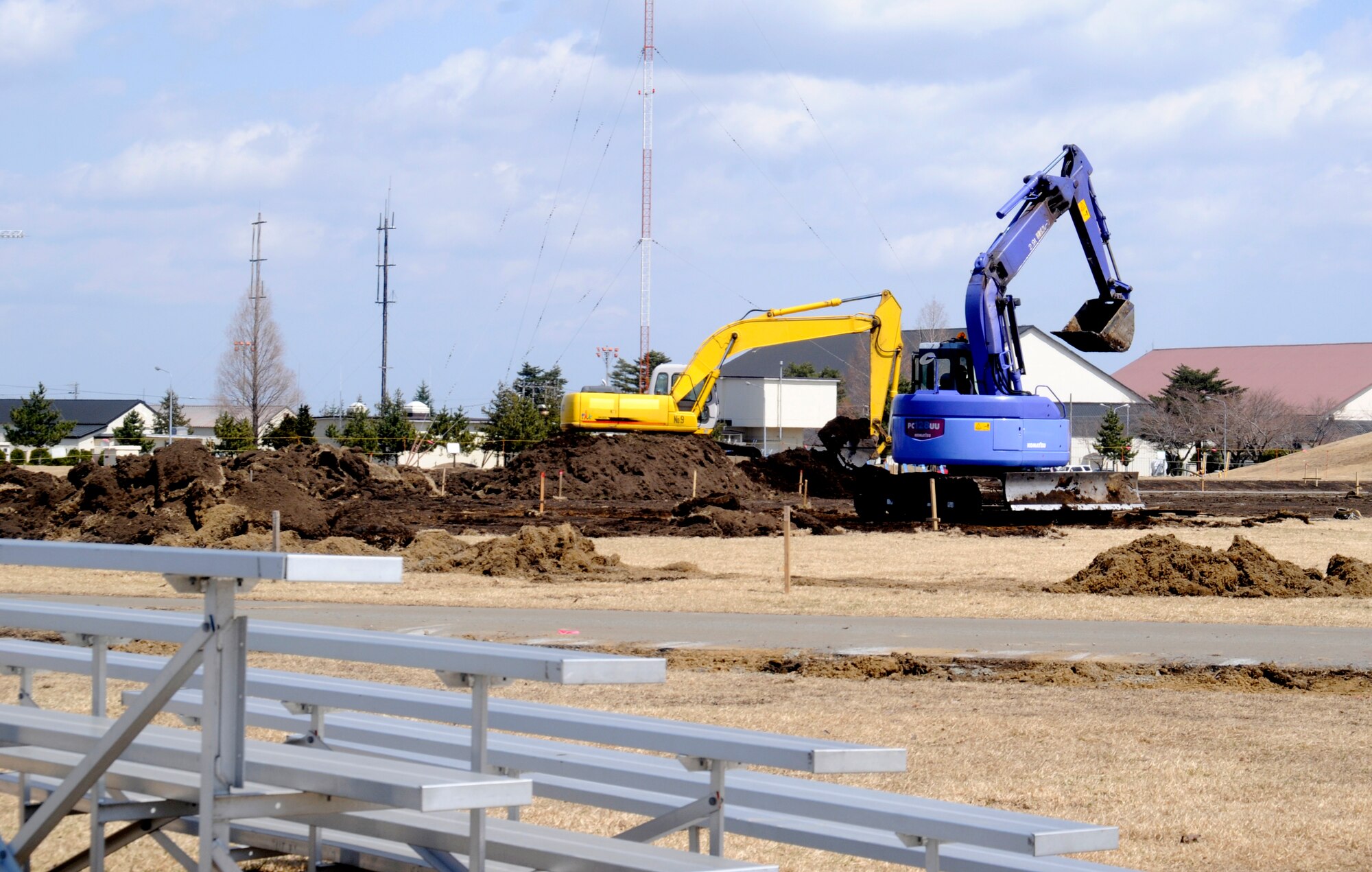 The 35th Civil Engineer Squadron demolishes the old track and field near Edgren High School at Misawa Air Base, Japan, April 14, 2012. The old field will be replaced by a multi-purpose football and soccer field that will have artificial turf. (U.S. Air Force photo by Airman 1st Class Zachary Kee/Released)