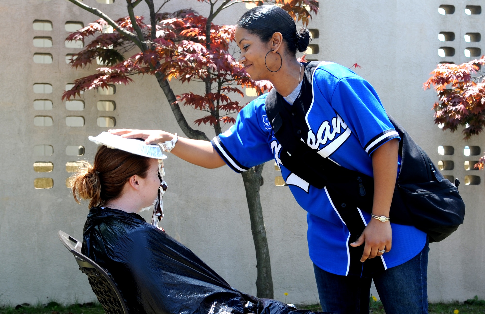 An Airman from the 8th Force Support Squadron gets a pie in the face during the Post-CUI Block Party, May 4, 2012, on Kunsan Air Base, Republic of Korea. After months of preparing for April’s Consolidated Unit Inspection, Wolf Pack members took a day to relax and have some fun.  (U.S. Air Force photo/Senior Airman Brigitte N. Brantley)