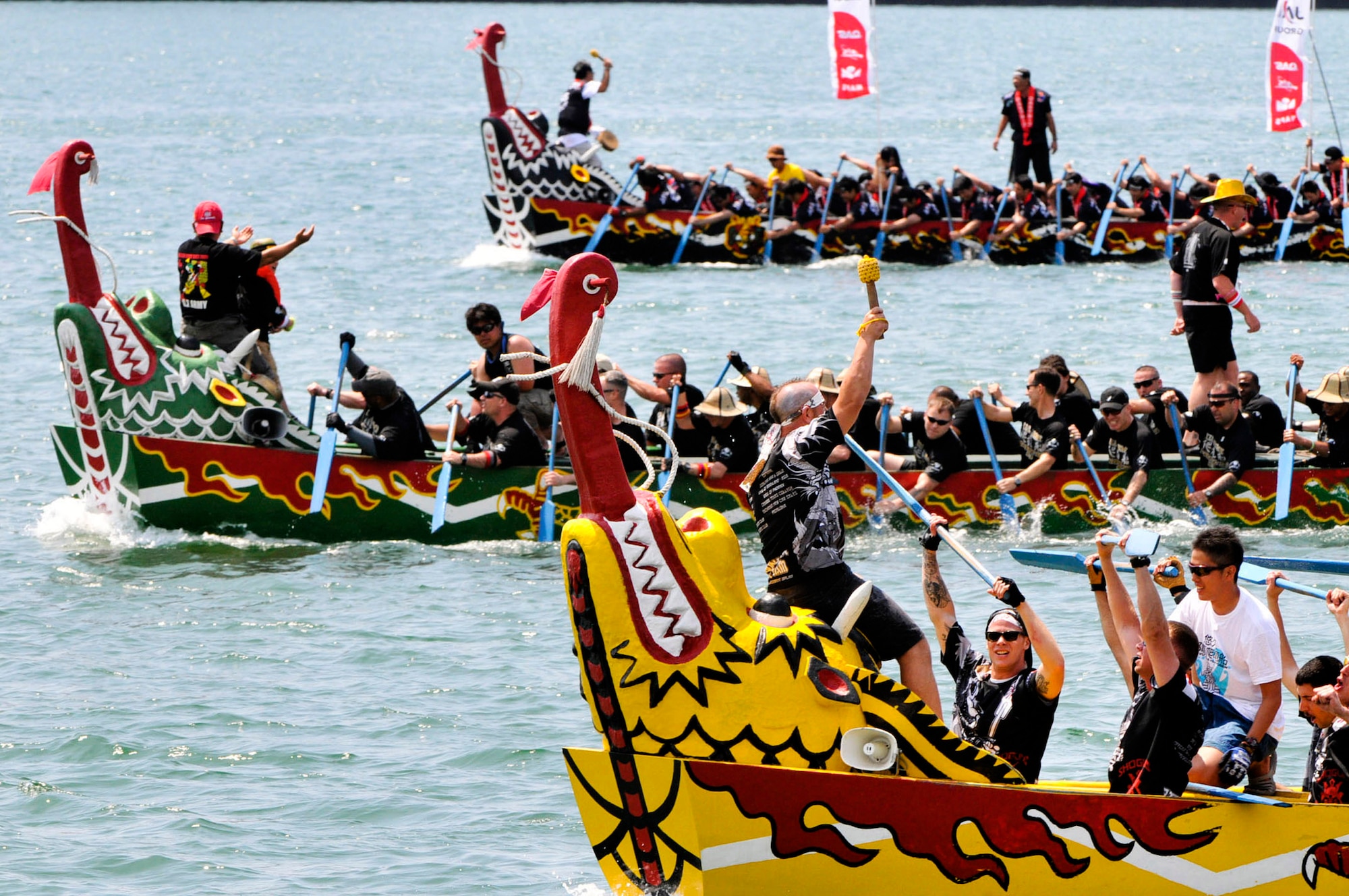 The Kadena Shogun men's team celebrates after coming in first place of their heat during the 38th Naha Dragon Boat Race at Naha City Port, Okinawa, May 5. The team beat the U.S. Army and Okinawa Airport Services teams with a time of 4 minutes, 58 seconds, which was the fastest time ever for an Air Force men's team. (U.S. Air Force photo/Staff Sgt. Darnell T. Cannady)  