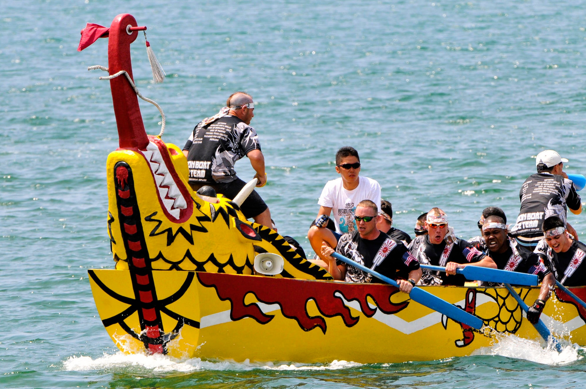 The Kadena Shogun men's team rows toward the finish line during the 38th Naha Dragon Boat Race at the Naha City port, Okinawa, May 5. The team beat the U.S. Army and Okinawa Airport Services teams with a time of 4 minutes, 58 seconds, which was the fastest time ever for the Shogun men's team. (U.S. Air Force photo/Staff Sgt. Darnell T. Cannady)  