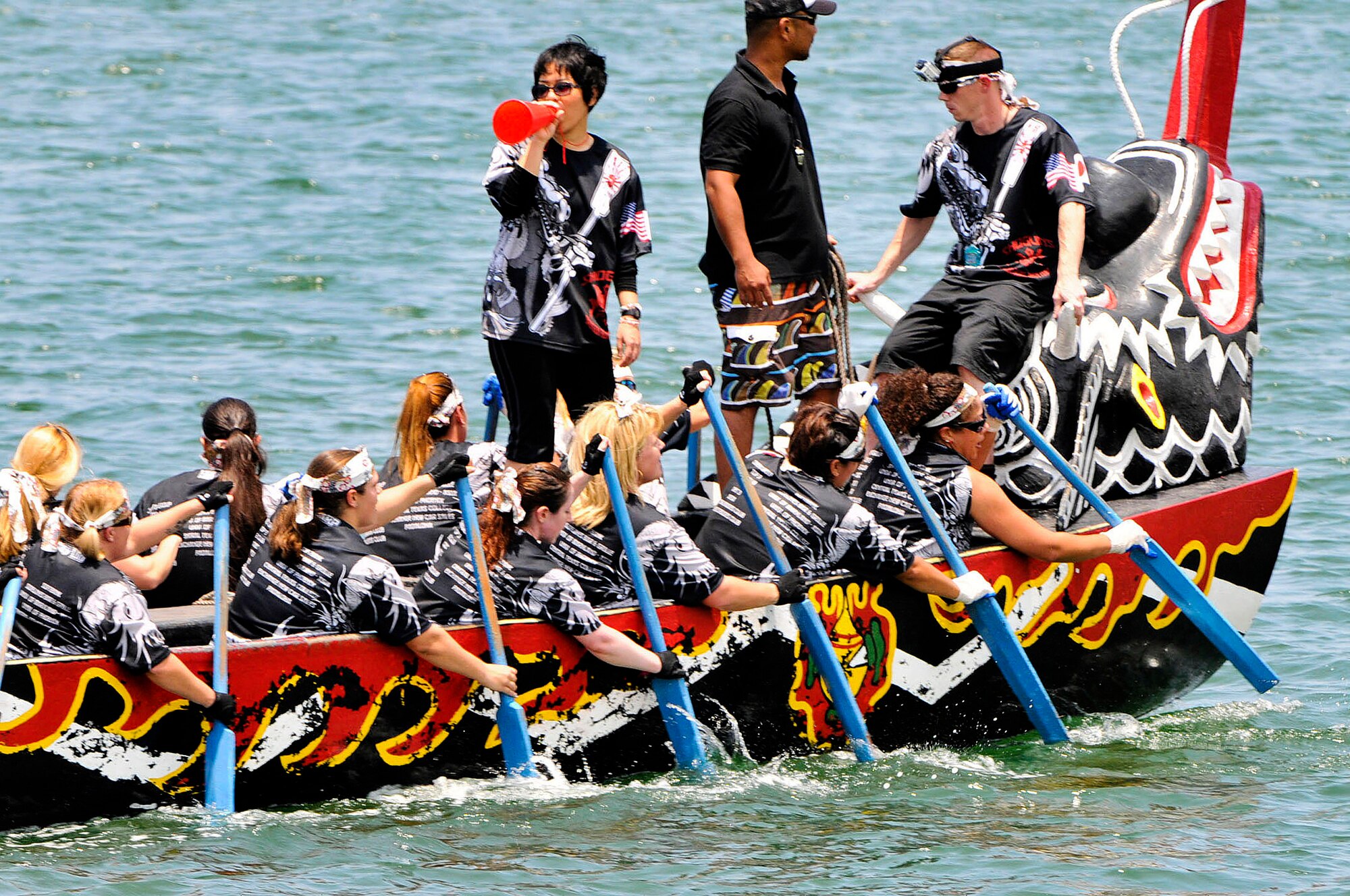 The Kadena Shogun women's team fights to stay ahead of the other teams during the 38th Naha Dragon Boat Race at Naha City port, Okinawa, May 5. The team placed third during their heat against the U.S. Army, and a local team, called "The Crazy Girls." (U.S. Air Force photo/Staff Sgt. Darnell T. Cannady)  
