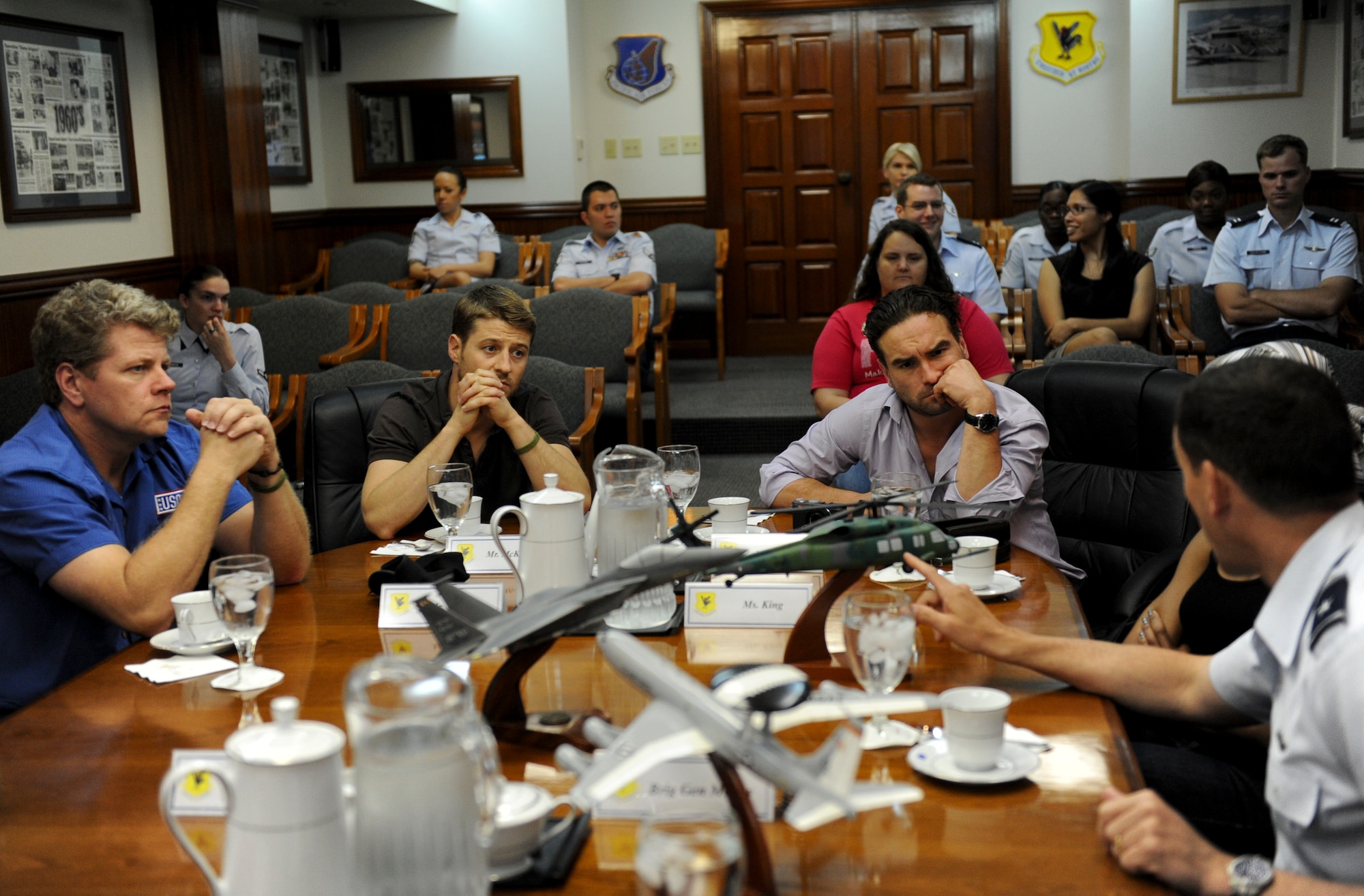 U.S. Air Force Brig. Gen. Matthew Molloy, 18th Wing commander, explains the types of air power that are available on Kadena Air Base, Japan, during a mission briefing with members of television’s “Southland” and “The Big Bang Theory”, May 7, 2012. The cast members are on a United Service Organizations (USO) tour throughout Japan  to visit with and say thank you to service members. (U.S. Air Force photo/Airman 1st Class Brooke P. Beers)