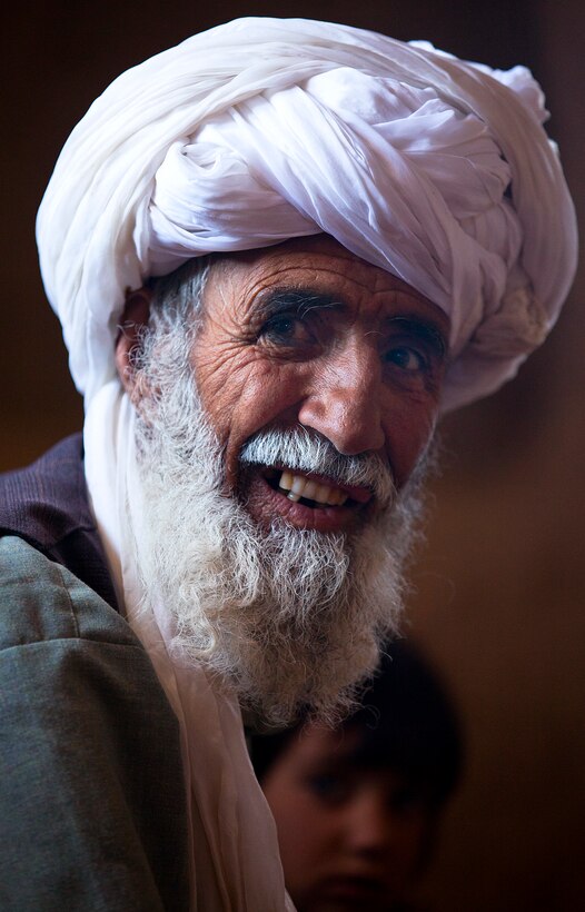 Hajji Ayatollah, a village elder in the Durzay region of Helmand province's Garmsir district, smiles after receiving a greeting from U.S. Marine Sgt. Ryan Brown, who is assigned to India Company, 3rd Battalion, 3rd Marine Regiment,  April 30, 2012. 