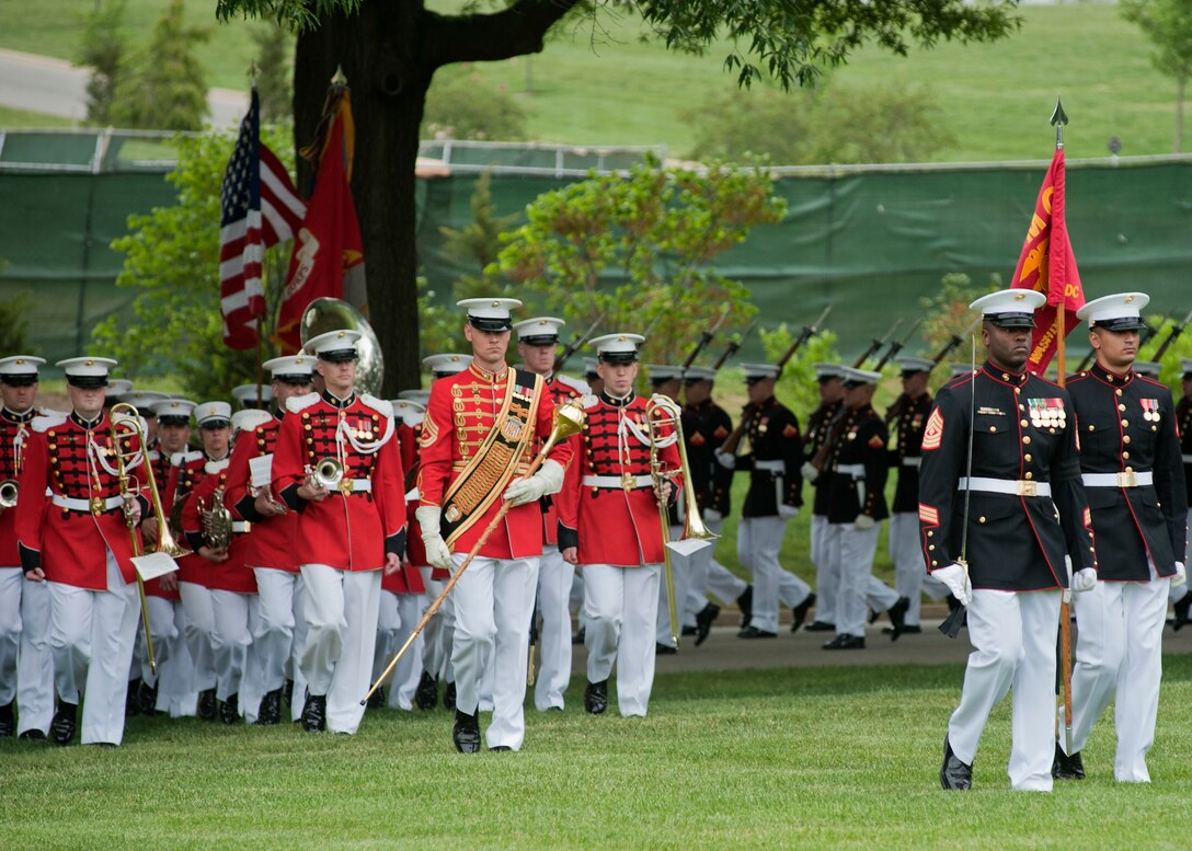 1st Sgt. Auburne Edwards, escort commander, leads the Marine Barracks Washington marching detail to the funeral site of Master Sgt. Scott E. Pruitt, a financial resource management analyst, during the funeral at Arlington National Cemetary May 8. Pruitt died from an improvised explosive device attack during combat maneuvers in Afghanistan, April 28. He was the first Marine in his job specialty to die in combat in Corps history.