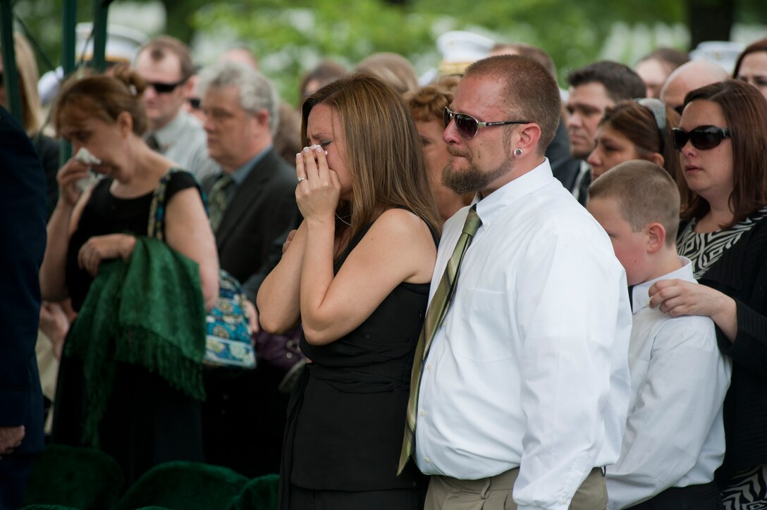 Family and friends in mourning congregate for their fallen hero, Master Sgt. Scott E. Pruitt, a financial resource management analyst, during his funeral at Arlington National Cemetary May 8. Marine Barracks Washington supported the Pruitts’ funeral just 10 days after he died from an improvised explosive device attack during combat maneuvers in Afghanistan. He was the first Marine in his job specialty to die in combat in Corps history.
