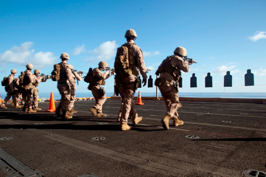 Reconnaissance Marines with Battalion Landing Team 3/1 walk toward and engage targets during live-fire training aboard USS Makin Island here May 7. The landing team serves as the ground combat element for the 11th Marine Expeditionary Unit. The unit embarked USS Makin Island, USS New Orleans and USS Pearl Harbor in San Diego Nov. 14 beginning a seven-month deployment to the Western Pacific, Horn of Africa and Middle East regions.