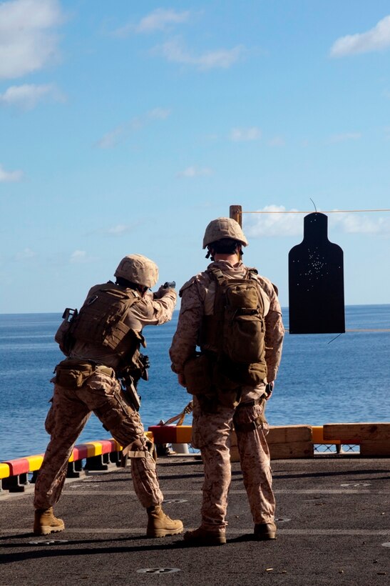 Reconnaissance Marines with Battalion Landing Team 3/1 practice small-arms firing techniques aboard USS Makin Island here May 7. The landing team serves as the ground combat element for the 11th Marine Expeditionary Unit. The unit embarked USS Makin Island, USS New Orleans and USS Pearl Harbor in San Diego Nov. 14 beginning a seven-month deployment to the Western Pacific, Horn of Africa and Middle East regions.