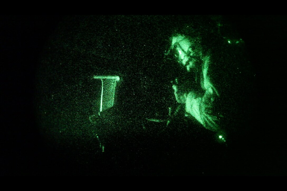 Lance Cpl. Garrett Kilgore, CH-46E Sea Stallion crew chief with Marine Medium Helicopter Squadron 265 (Reinforced), 31st Marine Expeditionary Unit, fires the mounted M2 .50 caliber machine gun out the side of a CH-46E Sea Knight helicopter during the night live-fire exercise here, May 8. Including three CH-46Es, two AH-1 Cobra attack helicopters and one UH-1N Huey helicopter, the exercise inserted notional Marines on an island after clearing the landing zone with live ordinance. The 31st MEU is the only continuously forward-deployed MEU and remains the nation’s force in readiness in the Asia-Pacific region.